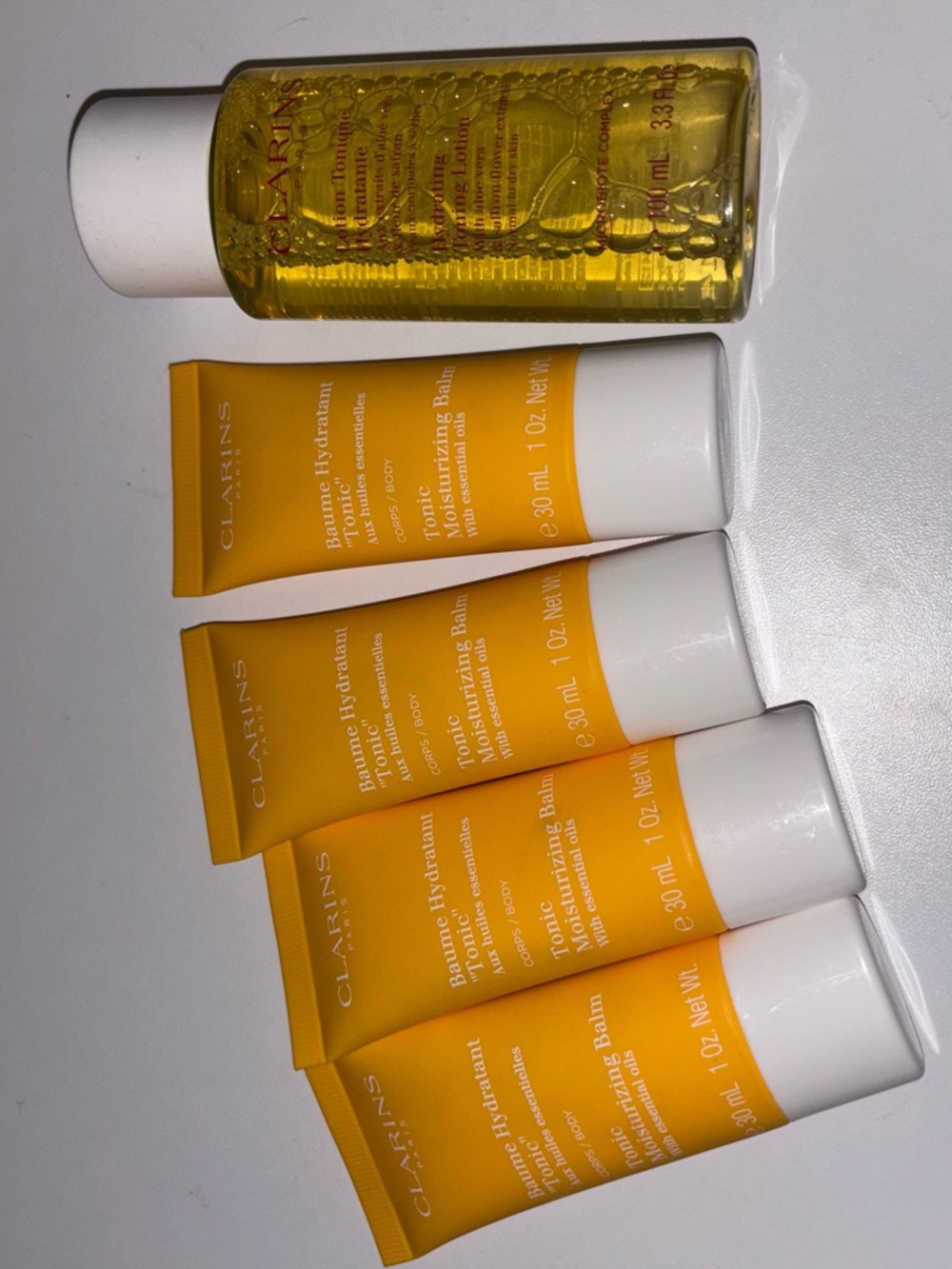 Clarins Yellow Tonic Moisturizing Balm - Body Tube and Clarins Toning Lotion